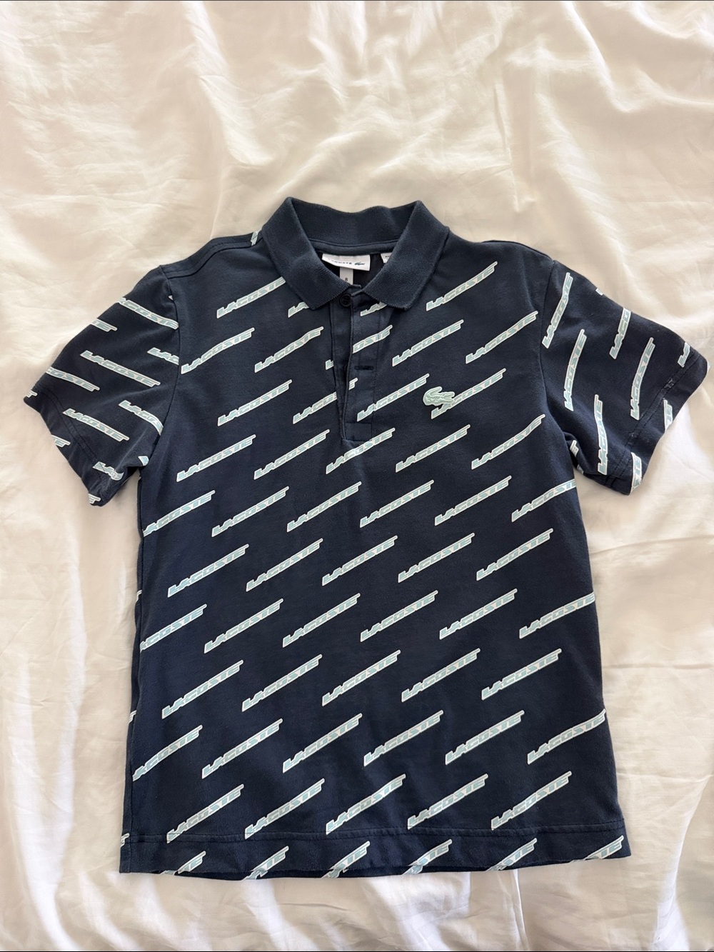 Lacoste Navy Polo with Light Blue Diagonal Stripe Print